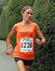 Running the first leg Rosie Smith (Durham City) leads the Northern Womens 4 Stage Road Relay.